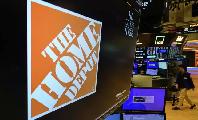 The logo for Home Depot is displayed above a trading post on the floor of the New York Stock Exchange, Tuesday, May 20, 2025. (AP Photo/Richard Drew)
