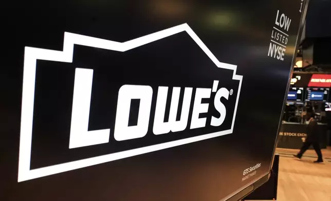 The logo for Lowe's is displayed above a trading post on the floor of the New York Stock Exchange, Tuesday, May 20, 2025. (AP Photo/Richard Drew)