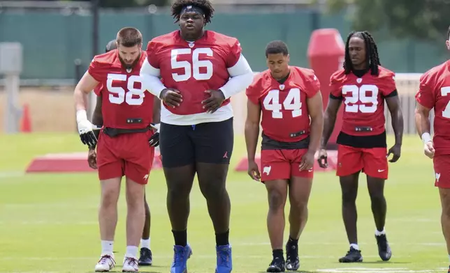 Tampa Bay Buccaneers nose tackle Desmond Watson (56) runs through a drill during the NFL football team's rookie minicamp Friday, May 9, 2025, in Tampa, Fla. (AP Photo/Chris O'Meara)