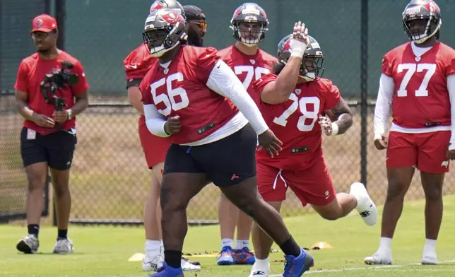 Tampa Bay Buccaneers nose tackle Desmond Watson (56) works against Dvon J-Thomas (78) during the NFL football team's rookie minicamp Friday, May 9, 2025, in Tampa, Fla. (AP Photo/Chris O'Meara)