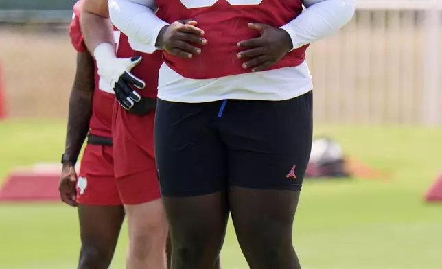 Tampa Bay Buccaneers nose tackle Desmond Watson (56) runs through a drill during the NFL football team's rookie minicamp Friday, May 9, 2025, in Tampa, Fla. (AP Photo/Chris O'Meara)