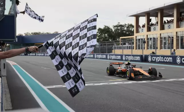 McLaren driver Oscar Piastri of Australia crosses the finish to win the Formula One Miami Grand Prix auto race Sunday, May 4, 2025, in Miami Gardens. Fla. (Shawn Thew/Pool Photo via AP)