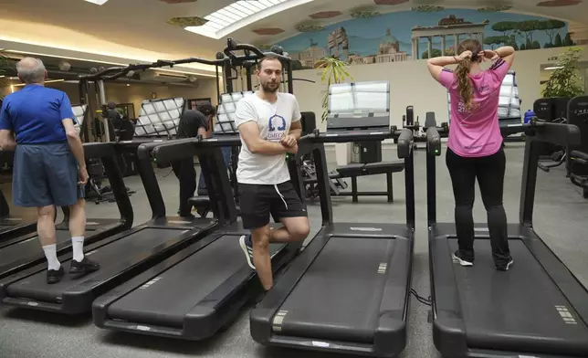 Personal trainer Valerio Masella, 26, who trained Robert Francis Prevost before the cardinal became Pope Leo XIV, poses at his gym near the Vatican, Wednesday, May 21, 2025. (AP Photo/Alessandra Tarantino)