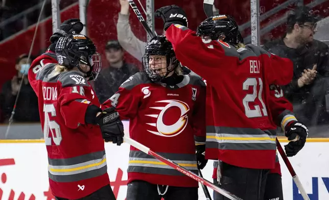 Ottawa Charge players celebrate after a goal against the Montreal Victoire during first-period PWHL hockey playoff action in Ottawa, Ontario, Friday, May 16, 2025. (Spencer Colby/The Canadian Press via AP)