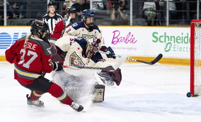 Ottawa Charge's Rebecca Leslie (37) scores against Montreal Victoire goaltender Ann-Renee Desbiens (35) during first-period PWHL hockey playoff action in Ottawa, Ontario, Friday, May 16, 2025. (Spencer Colby/The Canadian Press via AP)