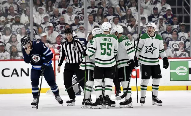 Dallas Stars' Mikko Rantanen, right, celebrates his goal against the Winnipeg Jets with teammates during the second period of an NHL hockey playoff game in Winnipeg, Manitoba, Wednesday, May 7, 2025. (Fred Greenslade/The Canadian Press via AP)