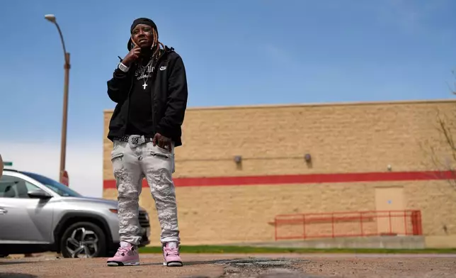 Tazz Webster, who ultimately wound up homeless after an apartment manager allegedly ridiculed and shoved him because he is transgender, speaks on the phone, April 9, 2025, in St. Louis. (AP Photo/Jeff Roberson)