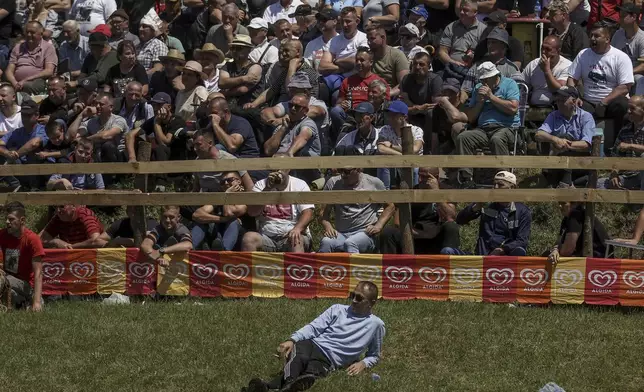 People watch the bullfights in Bijelo Polje, Bosnia, Sunday, May 11, 2025. (AP Photo/Armin Durgut)
