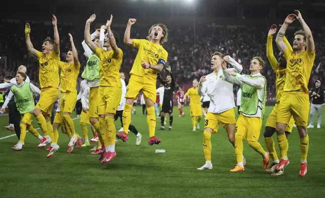 FILE - Bodo/Glimt players celebrate their qualification to the next phase after the end of the Europa League round of 16 second leg soccer match between Olympiacos FC and FK Bodo/Glimt at the Georgios Karaiskakis stadium at Athens' port of Piraeus, Greece, Thursday, March 13, 2025. (AP Photo/Thanassis Stavrakis, File)