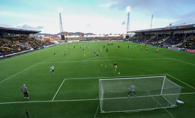 Players warm up before the start of the first leg quarter-final match of the UEFA Europa League between Bodø/Glimt and Lazio at Aspmyra Stadium in Bodo, Norway, Thursday March 13, 2025. (Lise Åserud/NTB Scanpix via AP)