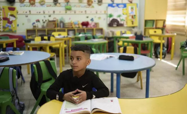 Laith Shweikeh, 9, sits at his desk at the UNRWA Boys' School run by the U.N. agency for Palestinian refugees in the Shuafat Refugee Camp in east Jerusalem, Tuesday, April 29, 2025. (AP Photo/Maya Alleruzzo)