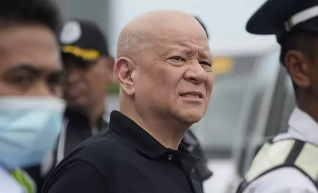 San Miguel Corp. President and CEO and Ninoy Aquino International Airport (NAIA) Infra Corp. chairman Ramon Ang monitors a vehicular accident near the departure entrance at Manila's International Airport Terminal 1, in Manila, Philippines on Sunday, May 4, 2025. (AP Photo/Aaron Favila)