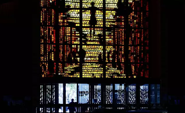 Worshippers enter the Cathedral of Saint Mary of the Assumption in San Francisco, Thursday, May 8, 2025, after newly elected Pope Leo XIV was announced. (Jessica Christian/San Francisco Chronicle via AP)