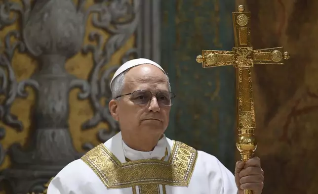 Newly elected Pope Leo XIV concelebrates Mass with the College of Cardinals inside the Sistine Chapel at the Vatican the day after his election as 267th pontiff of the Roman Catholic Church, Friday, May 9, 2025. (Vatican Media via AP)
