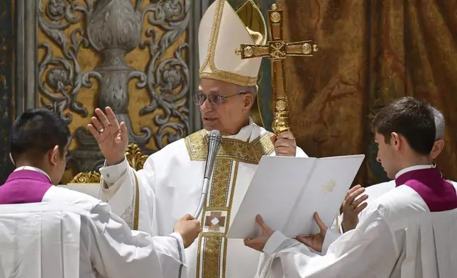 Newly elected Pope Leo XIV concelebrates Mass with the College of Cardinals inside the Sistine Chapel at the Vatican the day after his election as 267th pontiff of the Roman Catholic Church, Friday, May 9, 2025. (Vatican Media via AP)