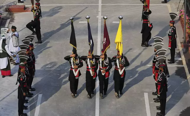 Pakistan's Rangers soldiers march during a daily closing ceremony at the Wagah, a joint post on the Pakistan and India border, near Lahore, Pakistan, Monday, May 5, 2025. (AP Photo/K.M. Chaudary)