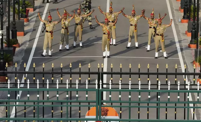 Indian Border Security Forces soldiers gesture during a daily closing ceremony at the Wagah, a joint post on the Pakistan and India border, near Lahore, Pakistan, Monday, May 5, 2025. (AP Photo/K.M. Chaudary)