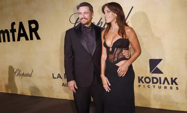 James Franco, left, and Izabel Pakzad pose for photographers upon arrival at the amfAR Cinema Against AIDS benefit at the Hotel du Cap-Eden-Roc, during the 78th Cannes international film festival, Cap d'Antibes, southern France, Thursday, May 22, 2025. (Photo by Joel C Ryan/Invision/AP)