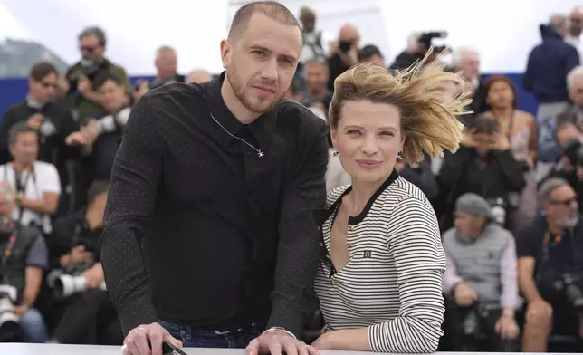 Bastien Bouillon, left, and Melanie Laurent pose for photographers at the photo call for the film 'Connemara' at the 78th international film festival, Cannes, southern France, Thursday, May 22, 2025. (AP Photo/Natacha Pisarenko)