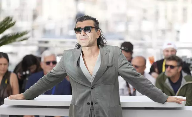 Director Fatih Akin poses for photographers at the photo call for the film 'Amrum' at the 78th international film festival, Cannes, southern France, Friday, May 16, 2025. (AP Photo/Natacha Pisarenko)