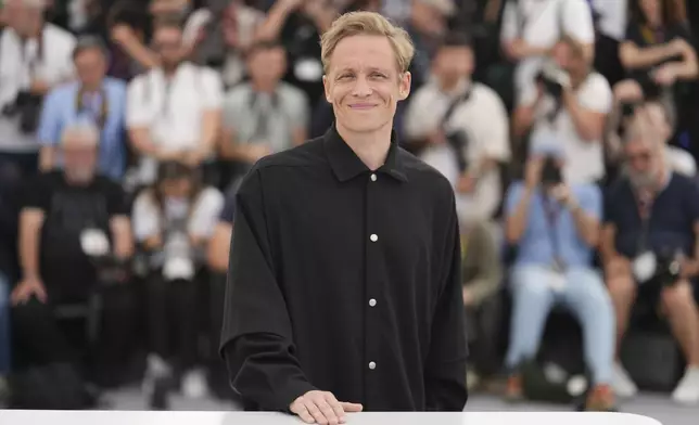Matthias Schweighofer poses for photographers at the photo call for the film 'Amrum' at the 78th international film festival, Cannes, southern France, Friday, May 16, 2025. (Photo by Lewis Joly/Invision/AP)