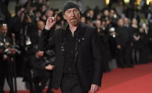 The Edge poses for photographers upon arrival at the premiere of the film 'Bono: Stories of Surrender' at the 78th international film festival, Cannes, southern France, Friday, May 16, 2025. (AP Photo/Natacha Pisarenko)