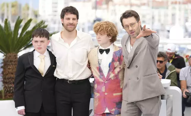 Kenny Rasmussen, from left, director Charlie Polinger, Kayo Martin and Joel Edgerton pose for photographers at the photo call for the film 'The Plague' at the 78th international film festival, Cannes, southern France, Friday, May 16, 2025. (AP Photo/Natacha Pisarenko)