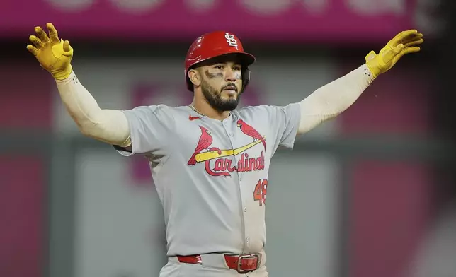 St. Louis Cardinals' Ivan Herrera celebrates on second after hitting a double during the eighth inning of a baseball game against the Kansas City Royals, Friday, May 16, 2025, in Kansas City, Mo. (AP Photo/Charlie Riedel)