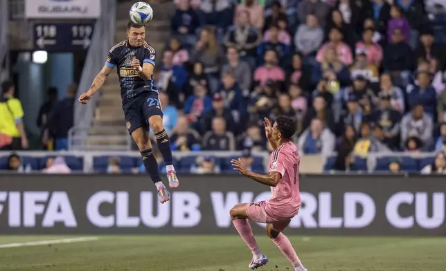 Philadelphia Union's Kai Wagner, left, leaps to head the ball over Inter Miami's Ian Fray, right, during the first half of an MLS soccer match, Saturday, May 24, 2025, in Chester, Pa.. (AP Photo/Chris Szagola)