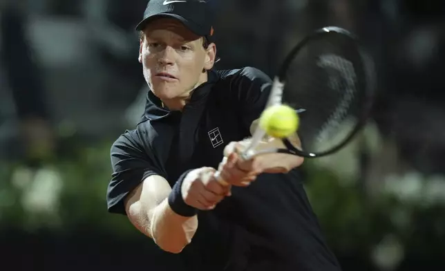 Italy's Jannik Sinner returns a shot during a round of sixteen match against Argentina's Francisco Cerundolo at the Italian Open tennis tournament in Rome, Tuesday, May 13, 2025. (AP Photo/Andrew Medichini)