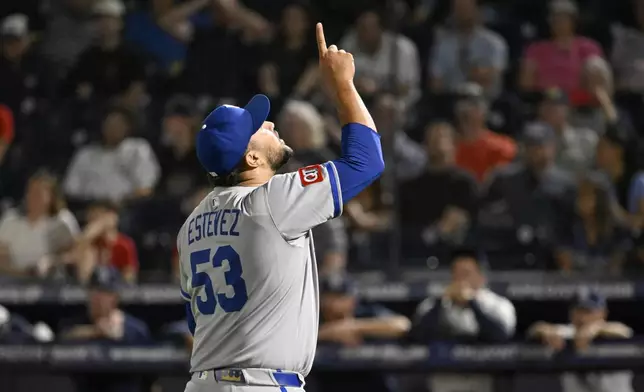 Kansas City Royals pitcher Carlos Estévez (53) celebrates after the final out of the Royals 3-0 win over the Tampa Bay Rays in a baseball game, Wednesday, April 30, 2025, in Tampa, Fla. (AP Photo/Jason Behnken)