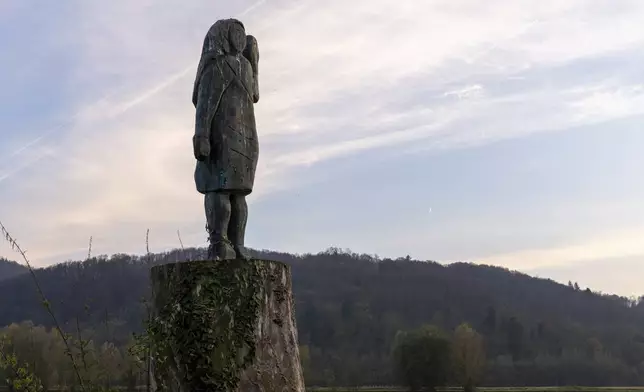 FILE -A bronze sculpture representing Melania Trump stands on a bank of the Sava river in the village of Rozno, near her hometown of Sevnica, Slovenia, Nov. 6, 2024. (AP Photo/Darko Bandic, File)