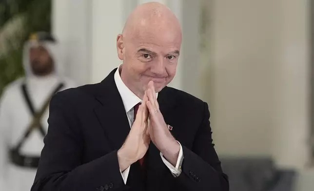 FIFA President Gianni Infantino gestures as he arrives for a state dinner hosted by Qatar's Emir Sheikh Tamim bin Hamad Al Thani in honor of President Donald Trump at Lusail Palace in Doha, Qatar, Wednesday, May 14, 2025. (AP Photo/Alex Brandon)