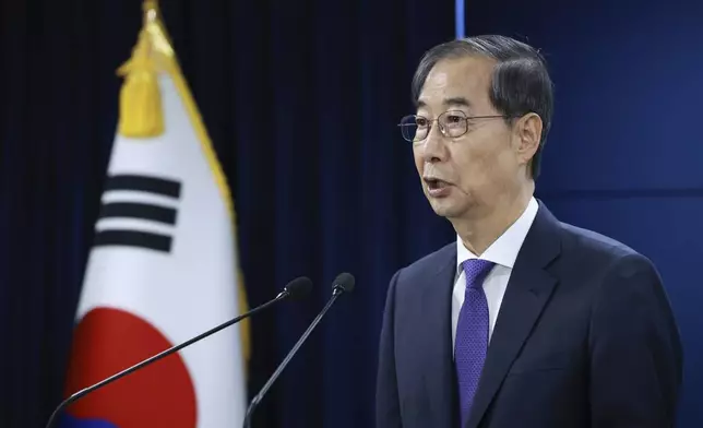 South Korean acting President Han Duck-soo speaks during a press conference at the Government Complex in Seoul, South Korea, Thursday, May 1, 2025. (Hong Hae-in/Yonhap via AP)
