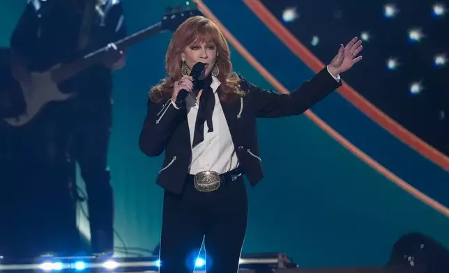 Host Reba McEntire performs "Okie from Muskogee" during the 60th annual Academy of Country Music Awards on Thursday, May 8, 2025, in Frisco, Texas. (AP Photo/Chris Pizzello)