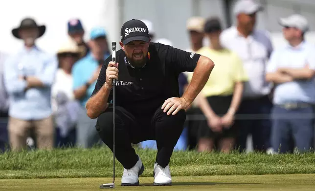 Shane Lowry, of Ireland, prepares to putt on the sixth hole during the final round of the Truist Championship golf tournament at the Philadelphia Cricket Club, Sunday, May 11, 2025, in Flourtown. (AP Photo/Matt Rourke)