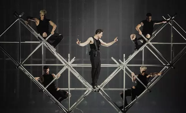 Theo Evan from Cyprus performs the song "Shh" during the first semi-final of the 69th Eurovision Song Contest, in Basel, Switzerland, Tuesday, May 13, 2025. (AP Photo/Martin Meissner)