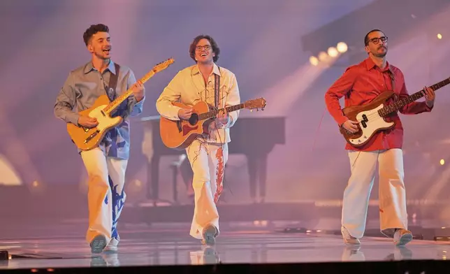 NAPA from Portugal performs the song "Deslocado" during the first semi-final of the 69th Eurovision Song Contest, in Basel, Switzerland, Tuesday, May 13, 2025. (AP Photo/Martin Meissner)