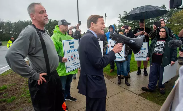 U.S. Sen. Richard Blumenthal, D-Conn., offers words of encouragement to striking Pratt &amp; Whitney employees at the Silver Lane entrance in East Hartford, Conn., on the first day of their strike, Monday, May 5, 2025. (Aaron Flaum/Hartford Courant via AP)