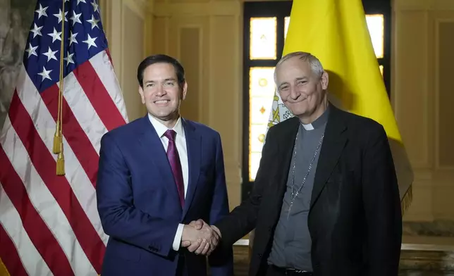 Secretary of State Marco Rubio, left, and President of the Conference of Italian Bishops, Cardinal Matteo Zuppi, pose for a photo at the U.S. Embassy to the Holy See in Rome, Saturday, May 17, 2025. (AP Photo/Gregorio Borgia)