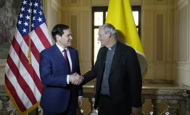 Secretary of State Marco Rubio, left, and President of the Conference of Italian Bishops, Cardinal Matteo Zuppi, pose for a photo at the U.S. Embassy to the Holy See in Rome, Saturday, May 17, 2025. (AP Photo/Gregorio Borgia)
