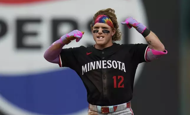 Minnesota Twins' Harrison Bader gestures at second base after hitting a double in the eighth inning of a baseball game against the Cleveland Guardians in Cleveland, Thursday, May 1, 2025. (AP Photo/Sue Ogrocki)