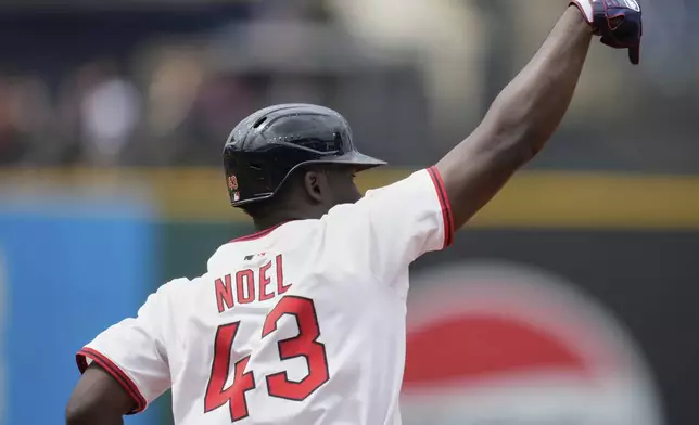 Cleveland Guardians' Jhonkensy Noel (43) gestures as he runs the bases after hitting a home run in the fourth inning of a baseball game against the Minnesota Twins in Cleveland, Thursday, May 1, 2025. (AP Photo/Sue Ogrocki)