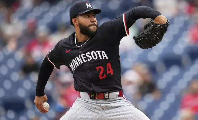 Minnesota Twins' Simeon Woods Richardson (24) pitches in the first inning of a baseball game against the Cleveland Guardians in Cleveland, Thursday, May 1, 2025. (AP Photo/Sue Ogrocki)
