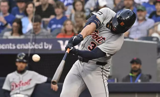 Detroit Tigers' Riley Greene hits a solo home run against the Toronto Blue Jays in second-inning baseball game action in Toronto, Friday, May 16, 2025. (/Jon Blacker/The Canadian Press via AP)