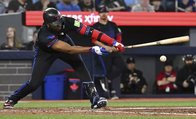 Toronto Blue Jays; Vladimir Guerrero Jr. hits a single against the Detroit Tigers in sixth-inning baseball game action in Toronto, Friday, May 16, 2025. (/Jon Blacker/The Canadian Press via AP)