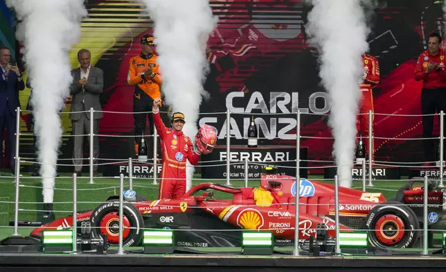 FILE - Ferrari driver Carlos Sainz of Spain celebrates after winning the Formula One Mexico Grand Prix auto race at the Hermanos Rodriguez racetrack in Mexico City, Oct. 27, 2024. (AP Photo/Eduardo Verdugo, File)