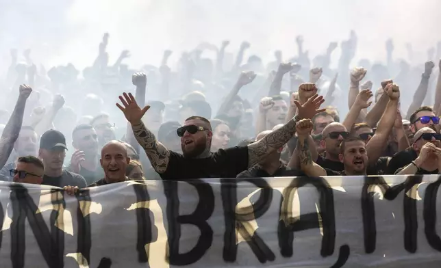 AC Milan fans hold a protest in the square of the Portello area of Milan, Italy near the club's headquarters on Saturday, May 24, 2025. (Stefano Porta/LaPresse via AP)
