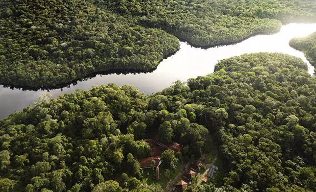 The Curua River crosses the Caxiuana National Forest with Emilio Goeldi Museum's scientific station at bottom in Para state, Brazil, Saturday, March 22, 2025. (AP Photo/Jorge Saenz)