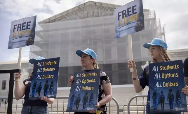 Supporters of charter schools rally outside of the Supreme Court on Wednesday, April 30, 2025, in Washington. (AP Photo/Mark Schiefelbein)